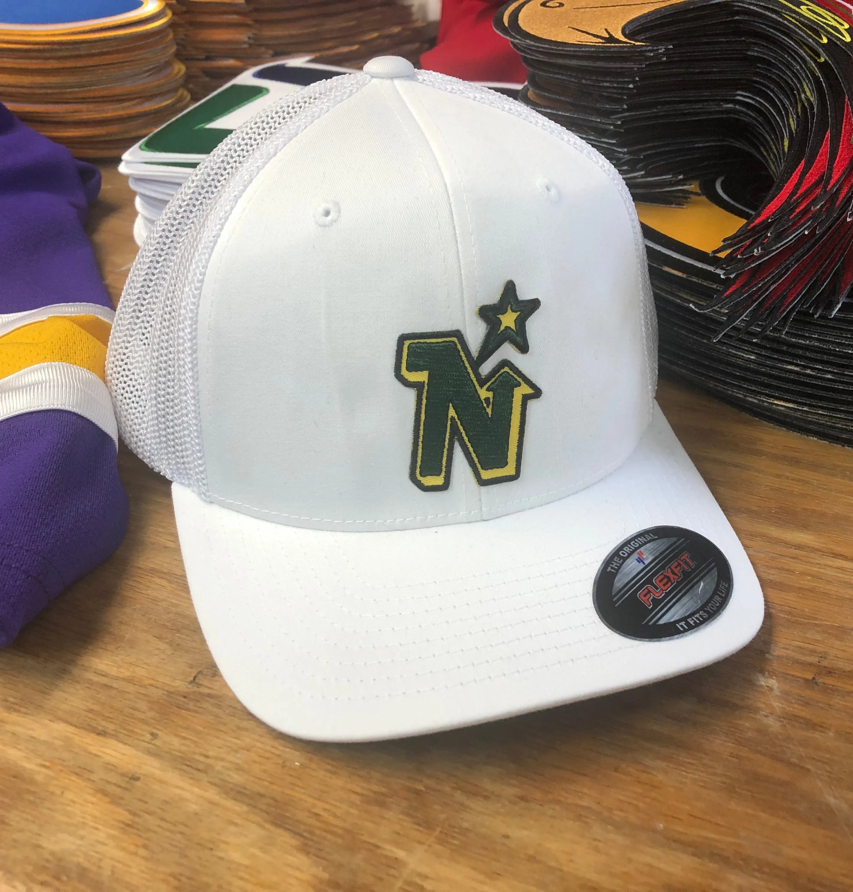 Flex-Fit Hat with a North Stars crest / logo $39 (White / White)